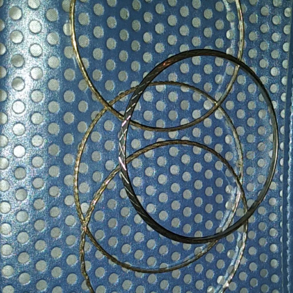 LOT of 4 silver tone bangle bracelets